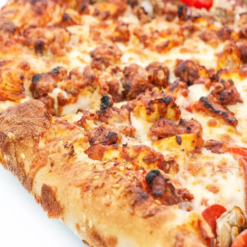 Delicious Butter Chicken Pizza at Pembina's Pizza Joint in Winnipeg, MB